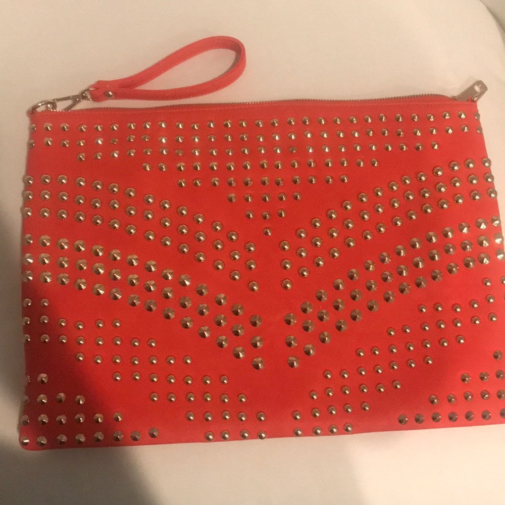 Bebe orange and gold studded large wristlet clutch